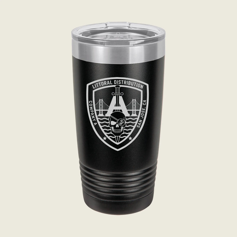 A black insulated travel tumbler with a clear lid, featuring a white and gray shield emblem on the front that reads 'Litoral Distribution' with a bridge and skull graphic, set against a light beige background.