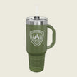 An olive green insulated travel tumbler with a handle, clear lid, and straw, featuring a white printed military-style crest on the front, shown on a light beige background.
