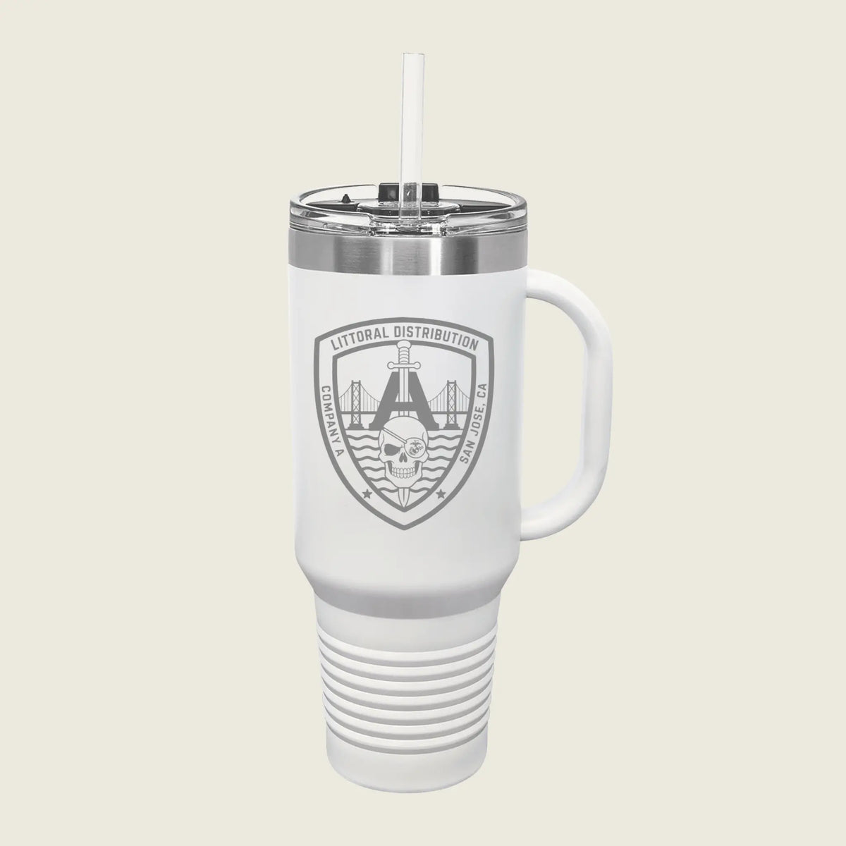 A white insulated travel tumbler with a handle, clear lid, and straw, featuring a gray shield logo that reads 'LITORAL DISTRIBUTION' with a bridge and skull graphic, on a light beige background.