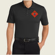 Black polo shirt with a red and yellow emblem on a beige background