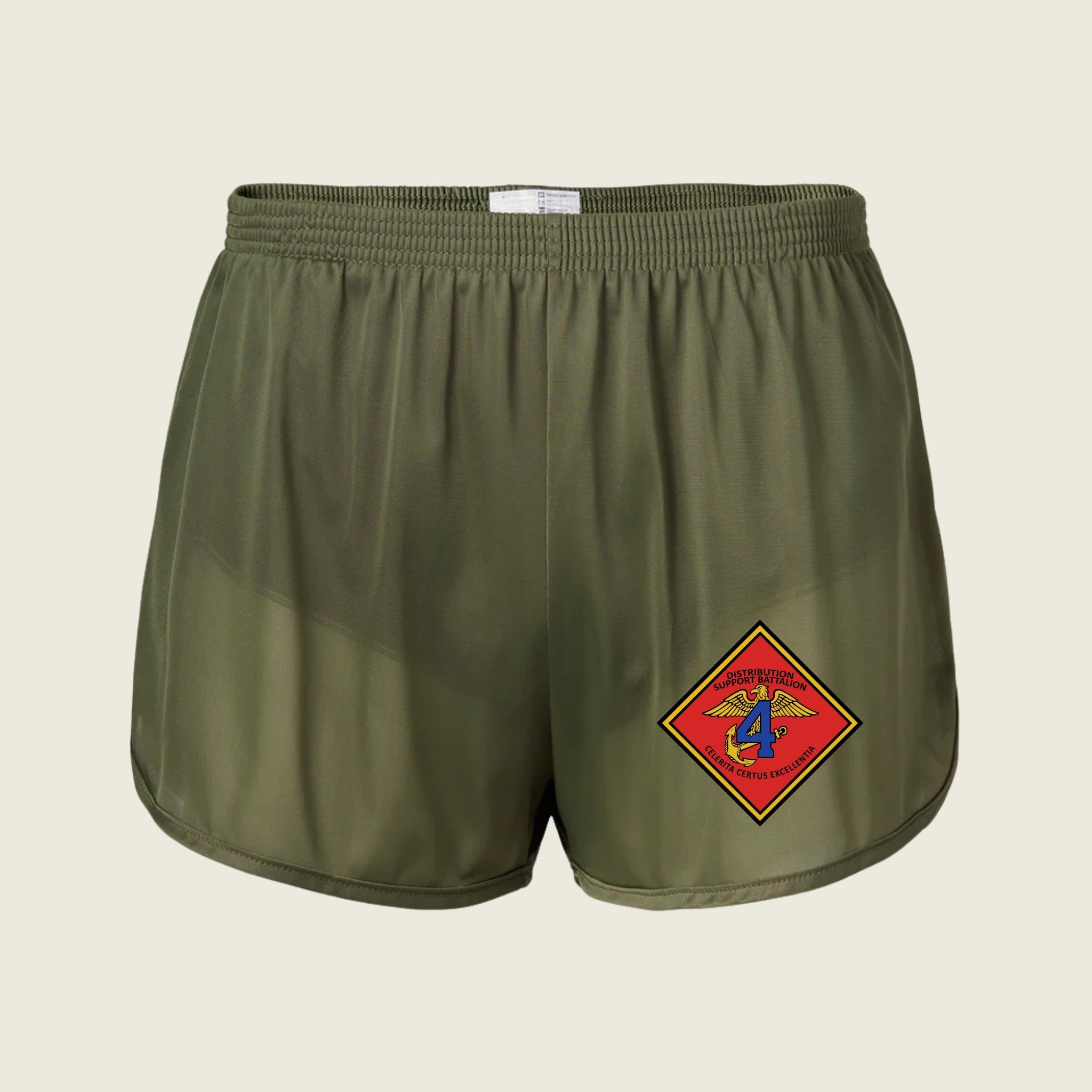 Green shorts with a red and yellow emblem on a beige background