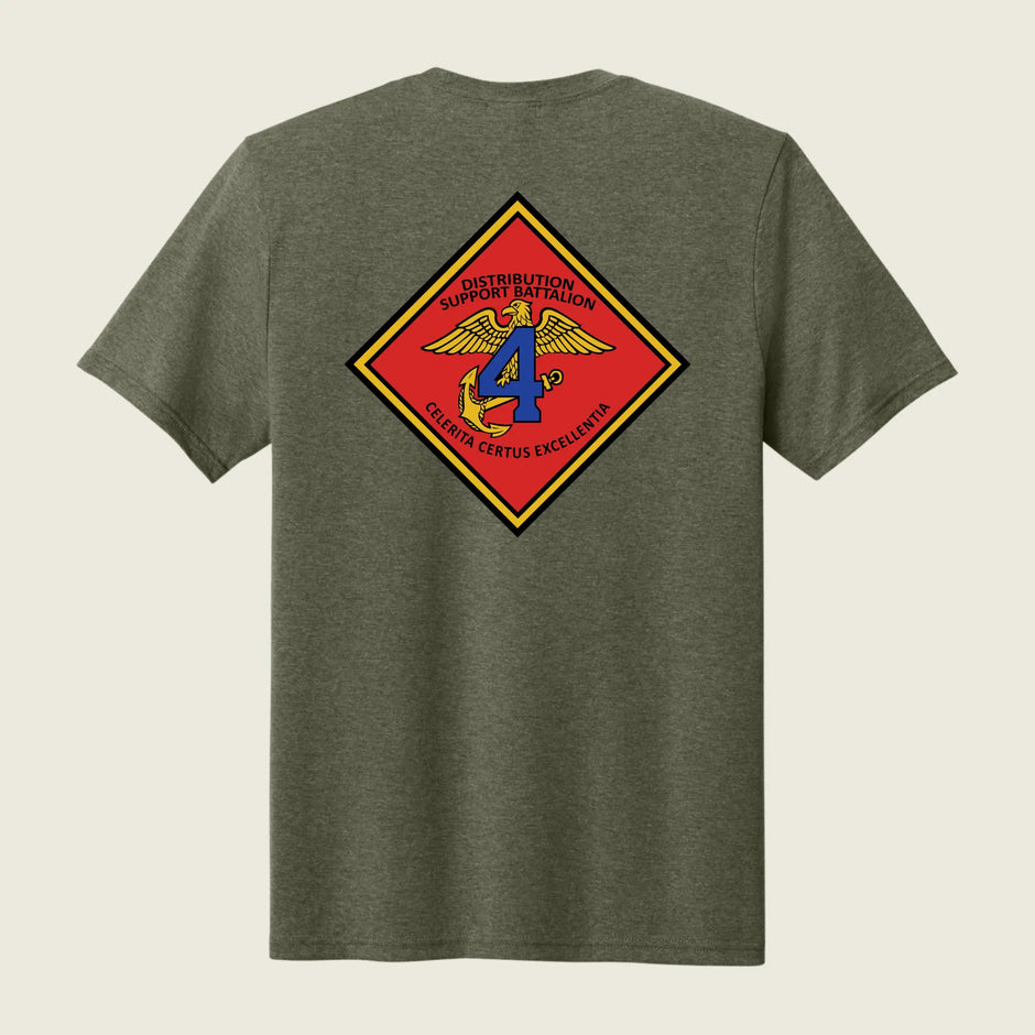 Green t-shirt with a colorful emblem on the back against a beige background