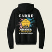 A black pullover hoodie shown from the back, featuring a colorful graphic print with the text 'CADRE' and 'MISSION: Motherhood & Readiness' around a central yellow badge design, on a light beige background.