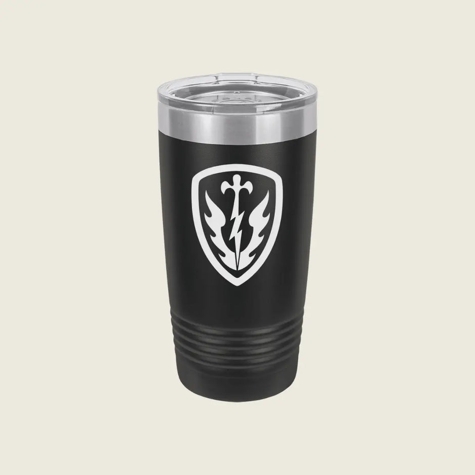 A black insulated travel tumbler with a clear lid, featuring a white shield emblem with a lightning bolt and leaf design on the front, set against a solid light beige background.