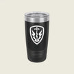 A black insulated travel tumbler with a clear lid, featuring a white shield emblem with a lightning bolt and leaf design on the front, set against a solid light beige background.