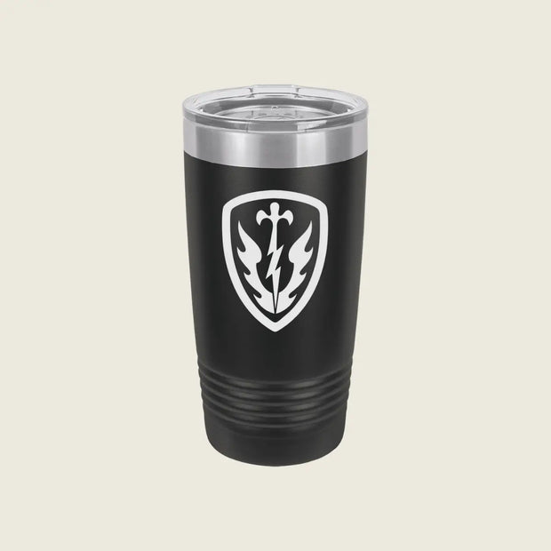 A black insulated travel tumbler with a clear lid, featuring a white shield emblem with a lightning bolt and leaf design on the front, set against a solid light beige background.