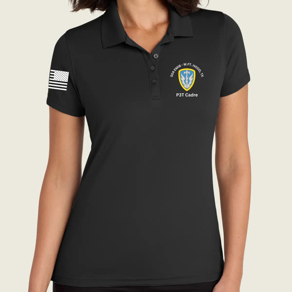 A woman wearing a black short-sleeve polo shirt with a black-and-white American flag patch on the right sleeve and a military-style crest on the left chest reading P3T Cadre.