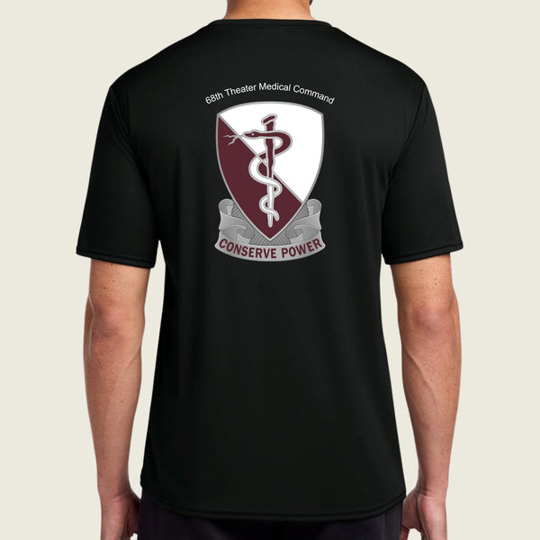 Black t-shirt with a medical emblem and text on the back, worn by a person.