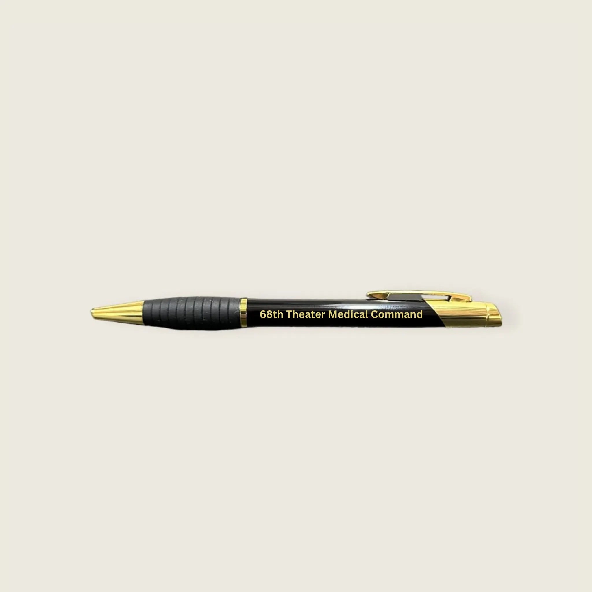 Pen with '68th Theater Medical Command' engraving on a beige background