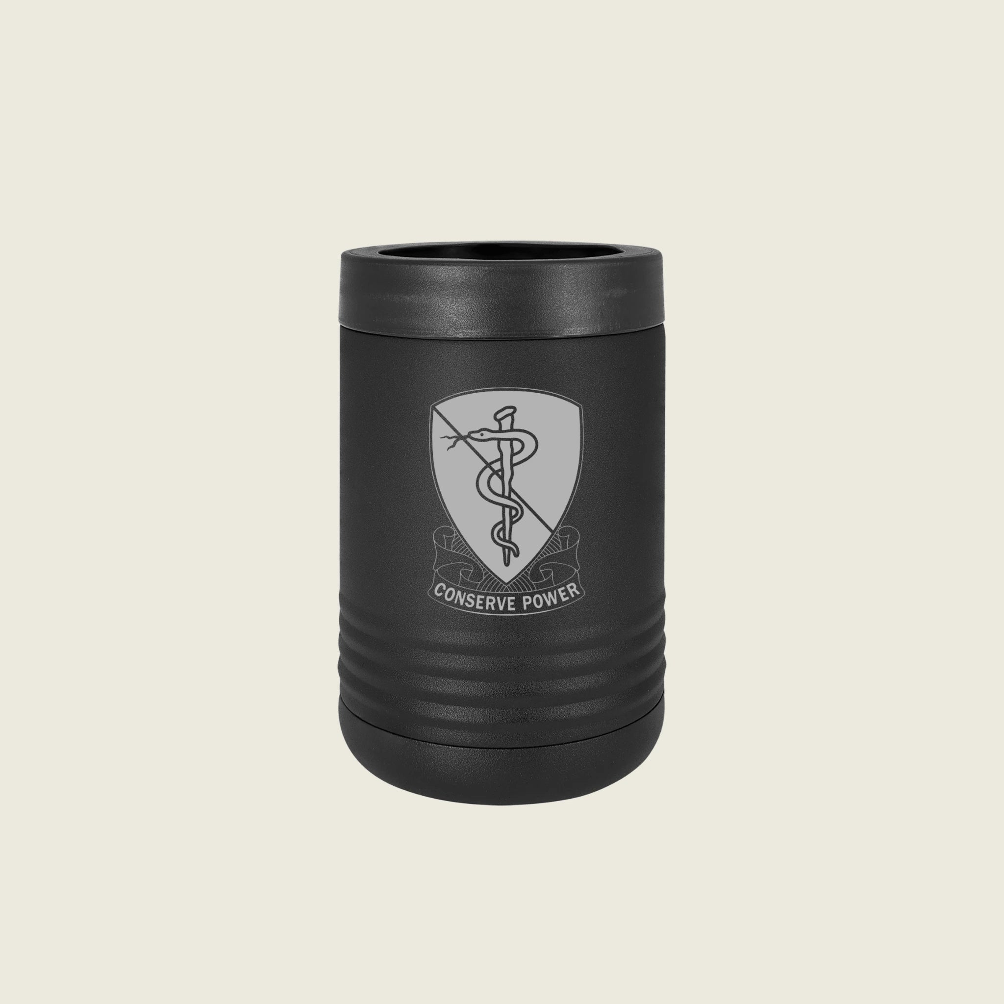 Black can cooler with an engraved emblem on a beige background