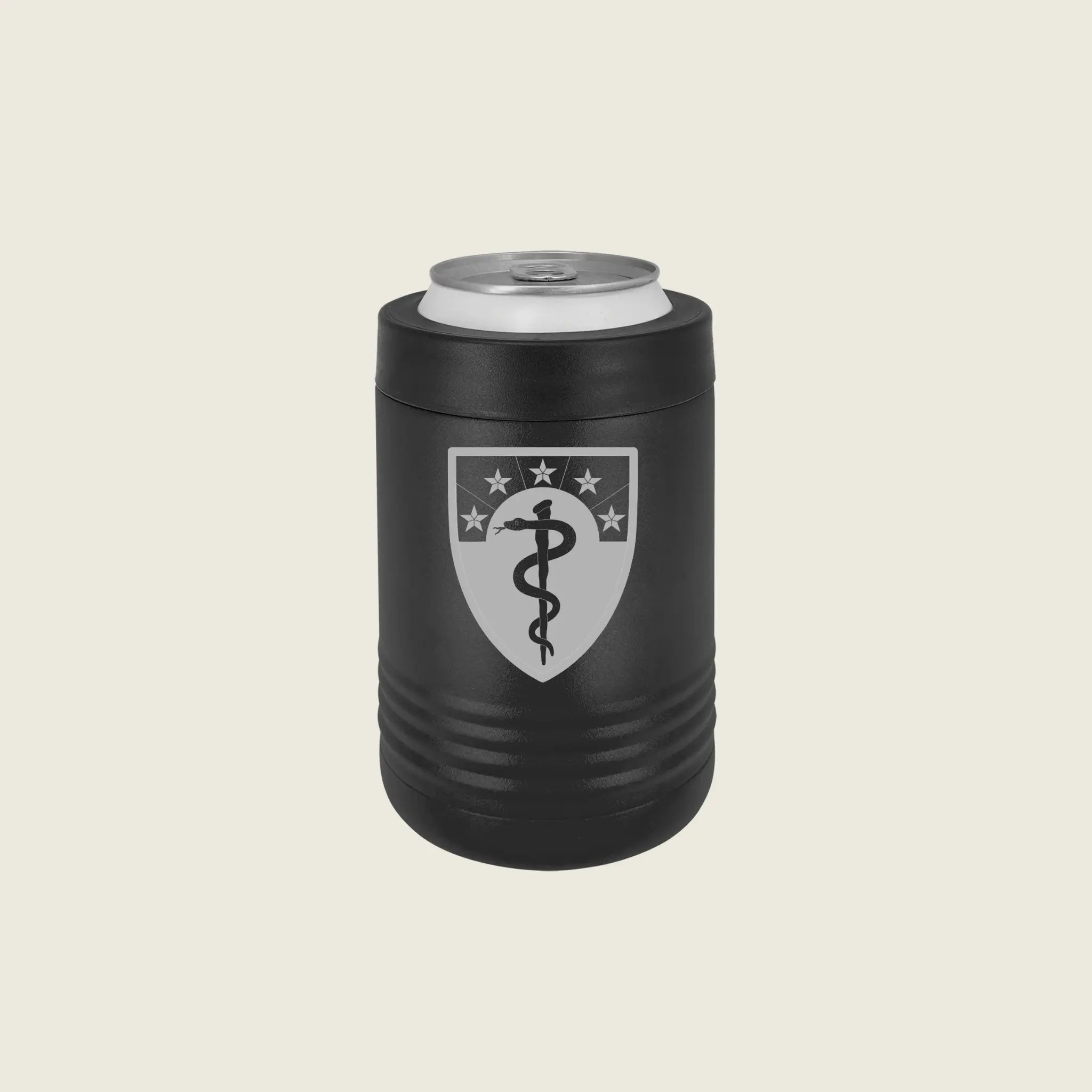 Black can cooler with an engraved emblem on a beige background