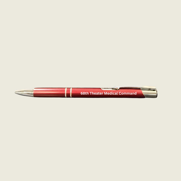 Red pen with '68th Theater Medical Command' text on a beige background