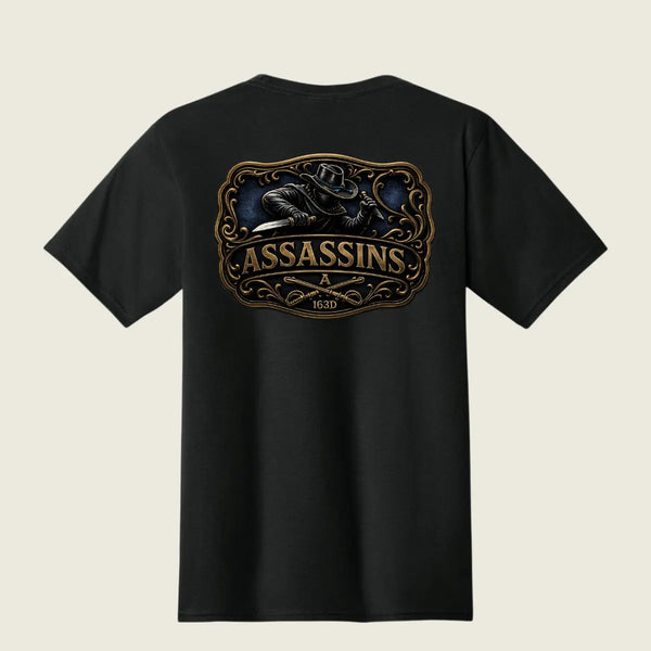 A black short-sleeve t-shirt shown from the back, featuring a large graphic print of a raven holding a knife inside an ornate frame, with the word 'ASSASSINS' and '163D' printed below in gold and brown tones.