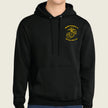 A black pullover hoodie with a yellow embroidered US Marine Corps Eagle, Globe, and Anchor emblem on the left chest, worn by a model against a light beige background.