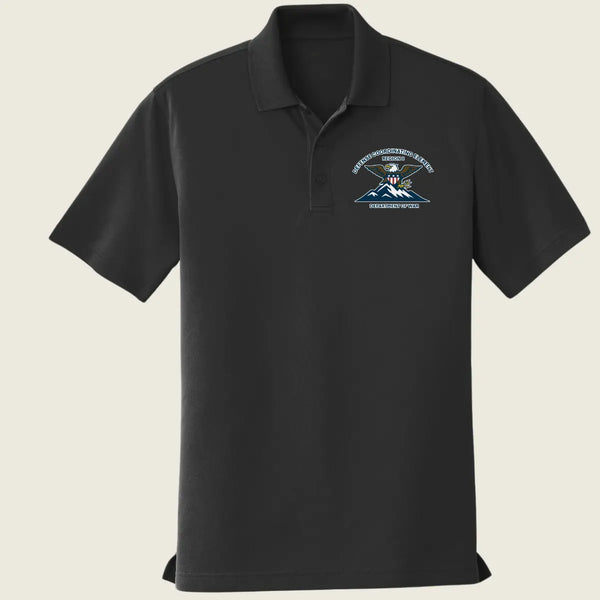 Black polo shirt with a logo printed on the front left pocket against a beige background