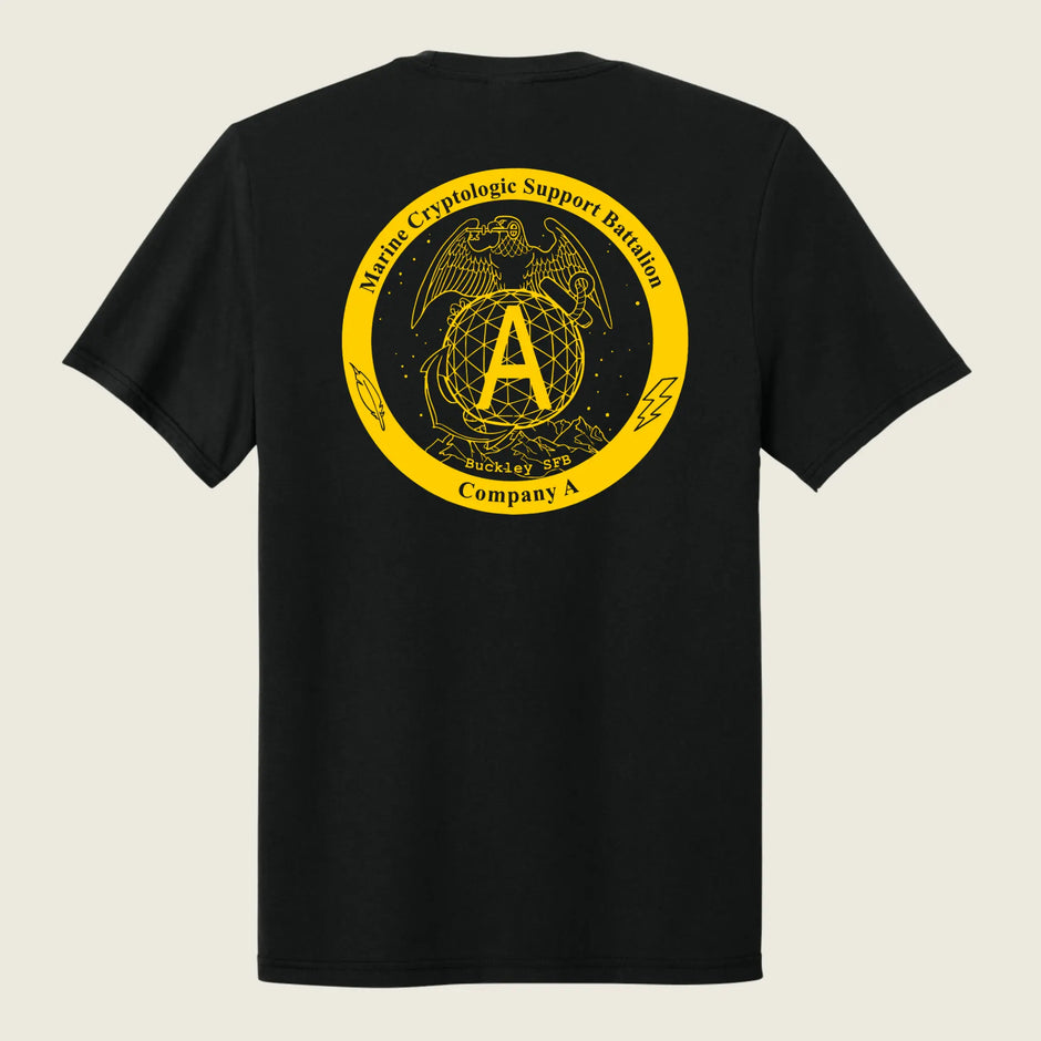 A black short-sleeve t-shirt shown from the back, featuring a large yellow circular graphic print on the upper back with an eagle, globe, and anchor emblem, and the text 'Marine Cryptologic Support Battalion' and 'Company A'.