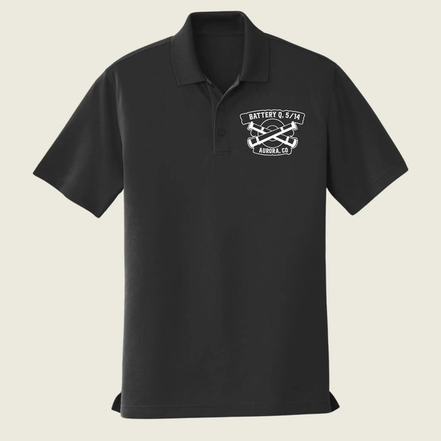 A black short-sleeve polo shirt with a white embroidered logo on the left chest reading 'BATTERY Q 5/14 AURORA, CO' around crossed tools, shown on a light beige background.
