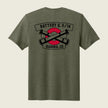 A heather olive green short-sleeve t-shirt shown from the back, featuring a graphic print of crossed black cannons over a red circle with banners reading 'BATTERY Q, 5/14' and 'AURORA, CO'.