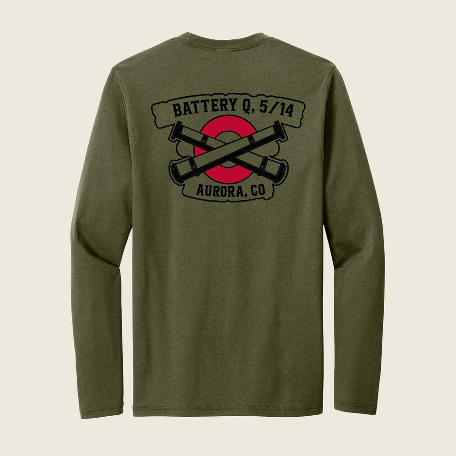 An olive green long-sleeve t-shirt shown from the back, featuring a black and red graphic print with crossed cannons and banners reading 'BATTERY Q, 5/14' and 'AURORA, CO'.