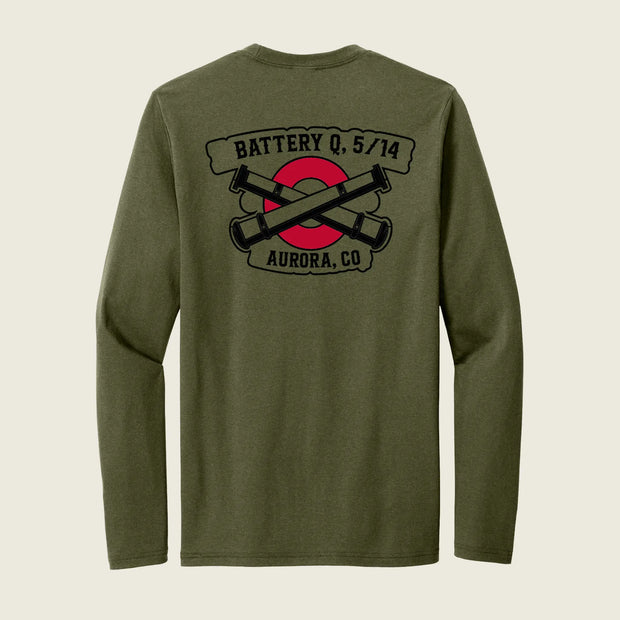 An olive green long-sleeve t-shirt shown from the back, featuring a black and red graphic print with crossed cannons and banners reading 'BATTERY Q, 5/14' and 'AURORA, CO'.