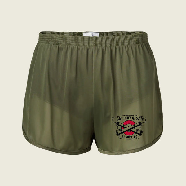 Olive green athletic shorts with an elastic waistband and a black, red, and white 'Battery Q 5/14 Aurora, CO' graphic on the lower left leg, shown against a light beige background.