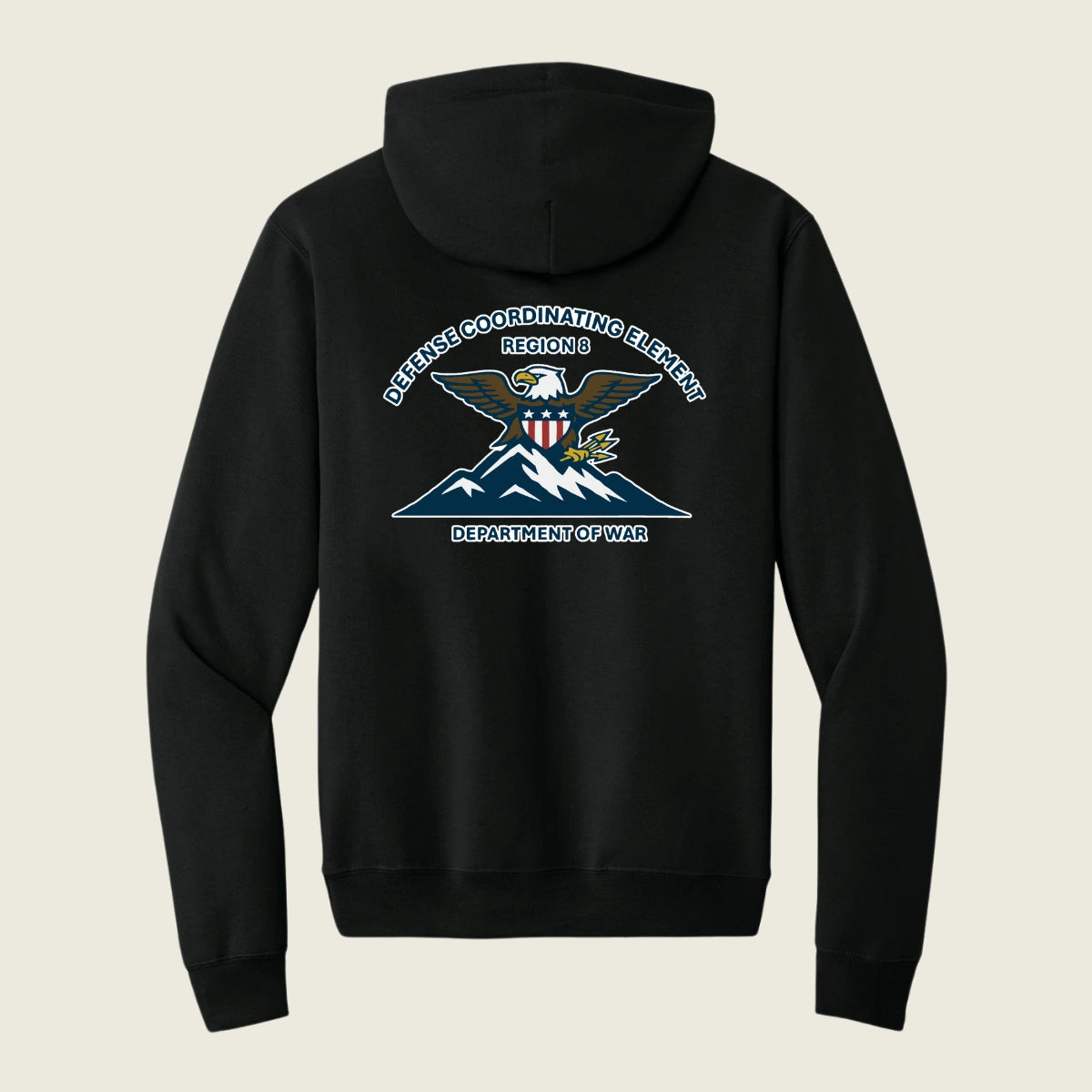 A black pullover hoodie shown from the back, featuring a large graphic print of an eagle over mountains with the text 'DEFENSE COORDINATING ELEMENT REGION 6 DEPARTMENT OF WAR' in white and blue.
