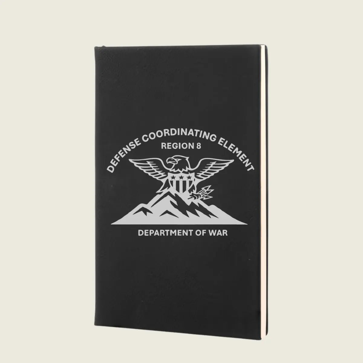 black journal with engraved logo on front