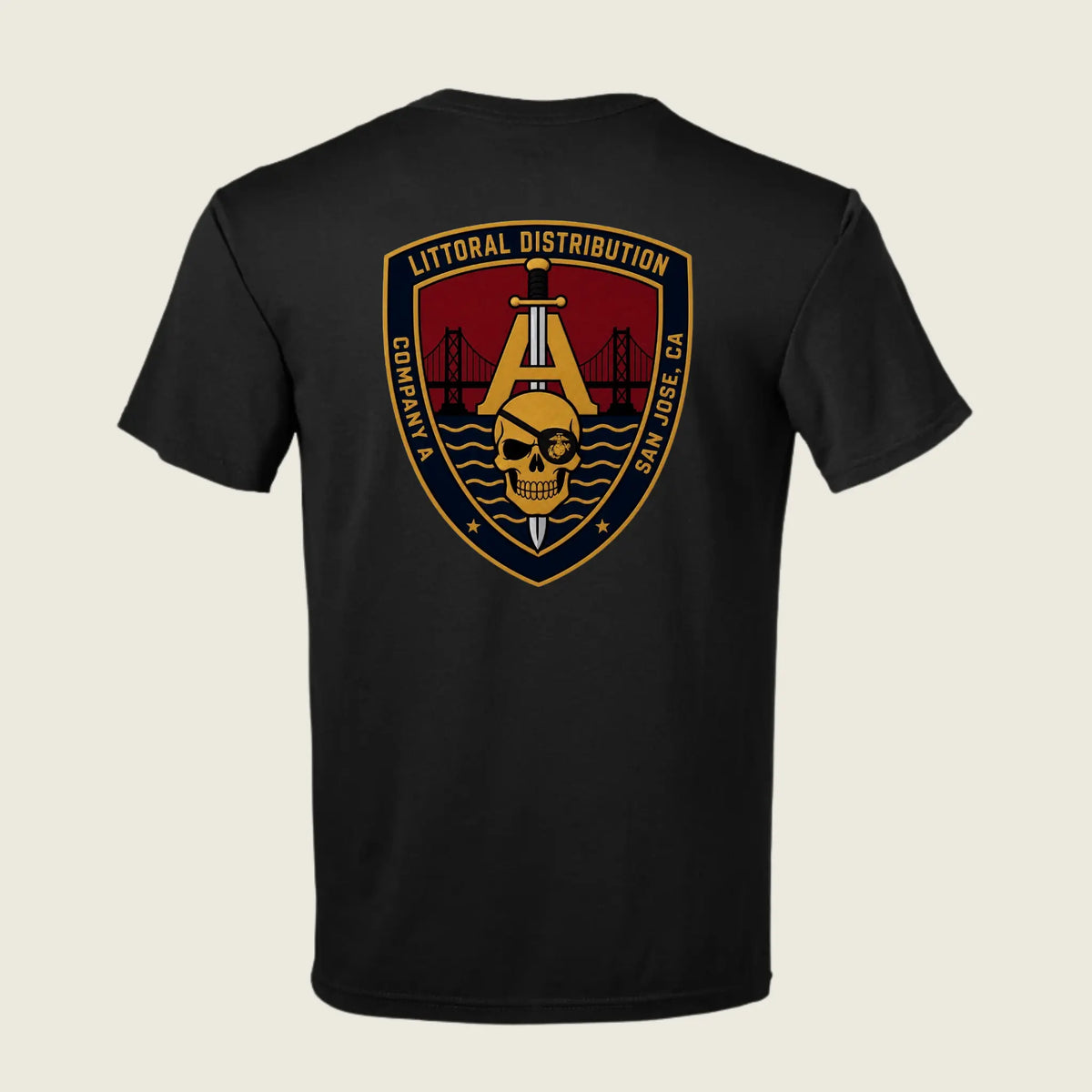 A black short-sleeve t-shirt shown from the back, featuring a large military-style graphic emblem on the upper back. The emblem is shield-shaped with a gold border, a gold anchor, a skull, and a red background, with text reading 'LITTORAL DISTRIBUTION' 