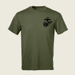 An olive green short-sleeve crewneck t-shirt featuring a black US Marine Corps Eagle, Globe, and Anchor emblem printed on the left chest, displayed against a light beige background.
