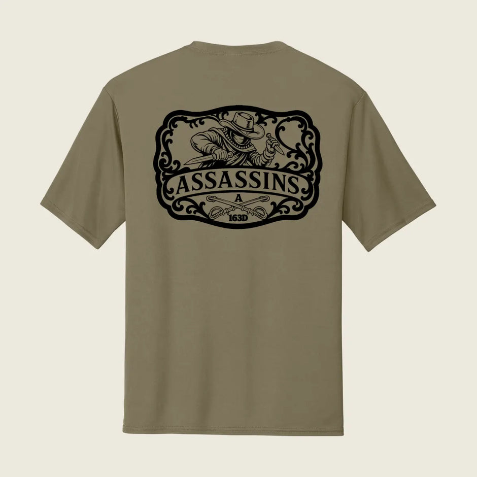 Assassins logo printed on the back of a coyote brown shirt 