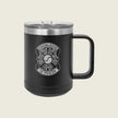 A matte black insulated travel mug with a clear lid and a black handle, featuring a white graphic design on the front that reads 'KNOWLEDGE IS POWER' around a circular emblem. The mug is photographed against a solid, light beige background.