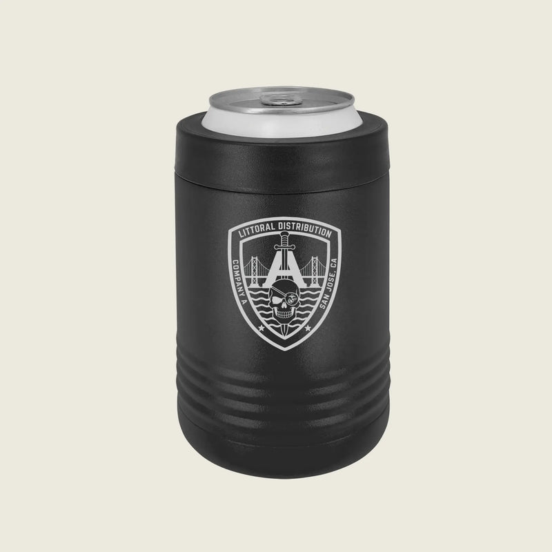 A matte black insulated can cooler sleeve holding a silver aluminum can, featuring a white shield emblem with a bridge, skull, on a light beige background.