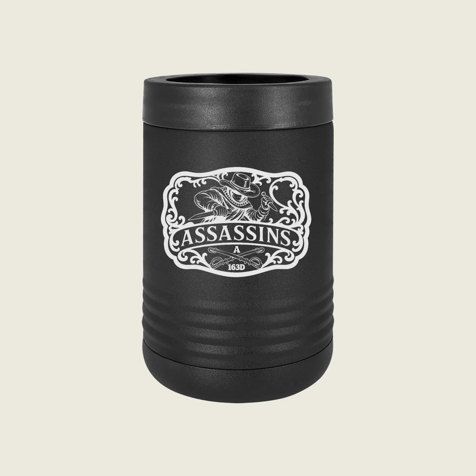 A matte black insulated can cooler with a lid, featuring a white graphic print of a hunting dog and the word 'ASSASSINS' on the front, set against a solid light beige background.