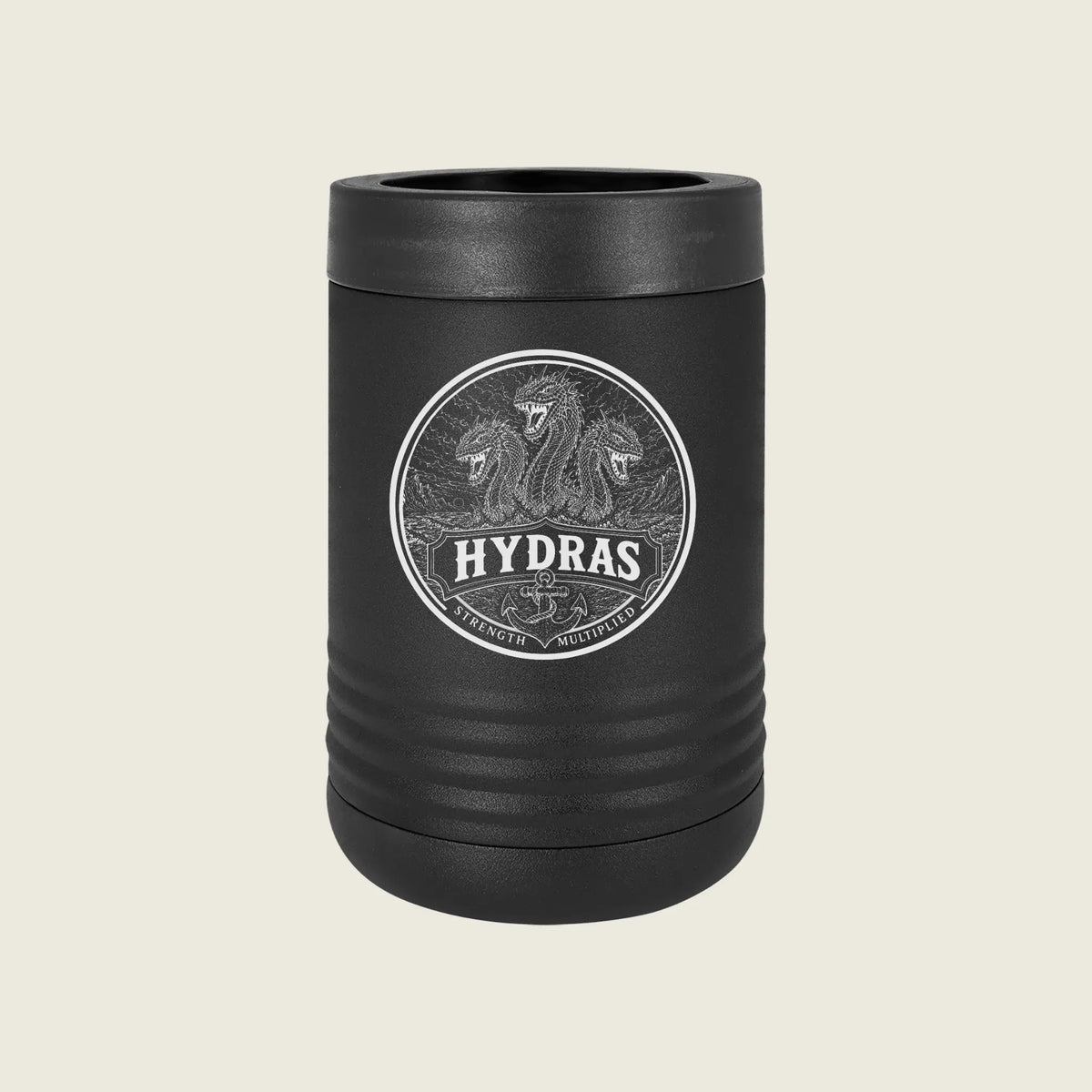 A matte black insulated can cooler with a matching lid, featuring a circular silver graphic of three lions and the brand name 'HYDRAS' on the front, set against a solid light beige background.