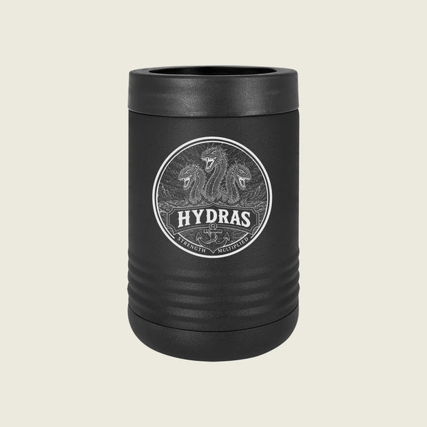 A matte black insulated can cooler with a matching lid, featuring a circular silver graphic of three lions and the brand name 'HYDRAS' on the front, set against a solid light beige background.