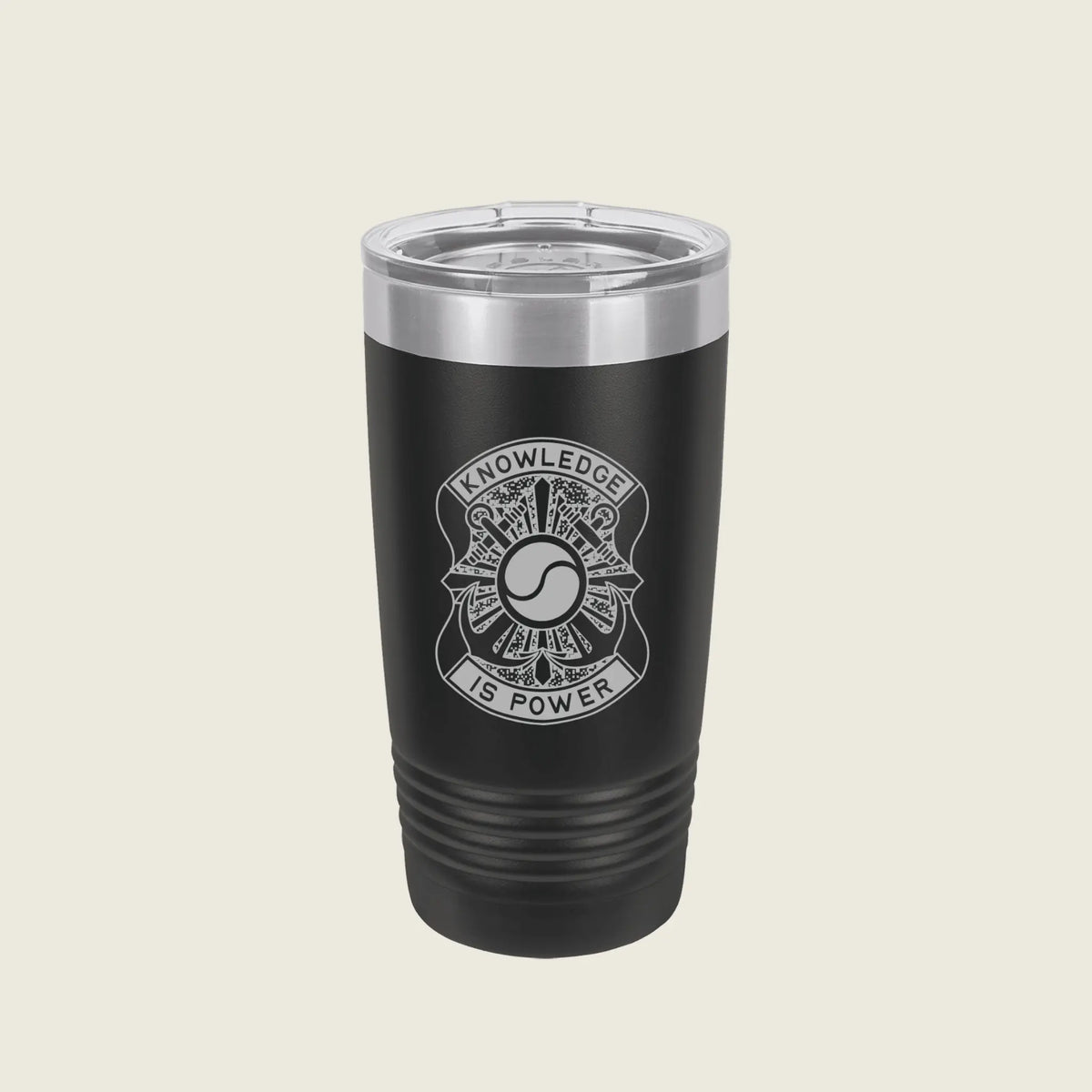 A black insulated travel tumbler with a clear lid, featuring a silver engraved emblem and the words 'KNOWLEDGE IS POWER' on the front, set against a solid light beige background.