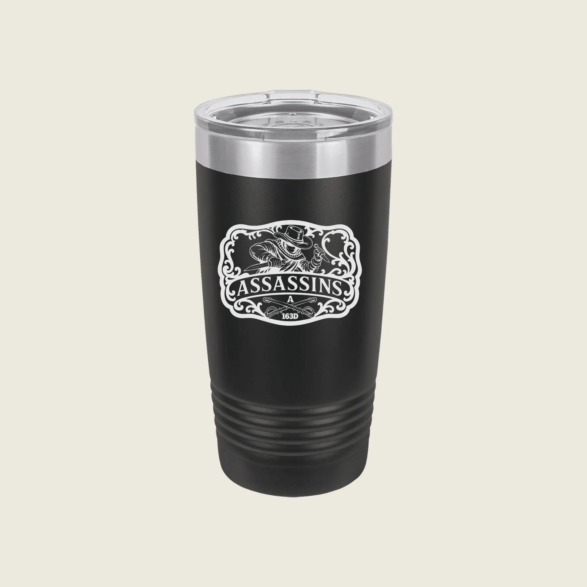 A black insulated travel tumbler with a clear lid, featuring a white 'Assassins & 1920' graphic on the front, set against a solid light beige background.