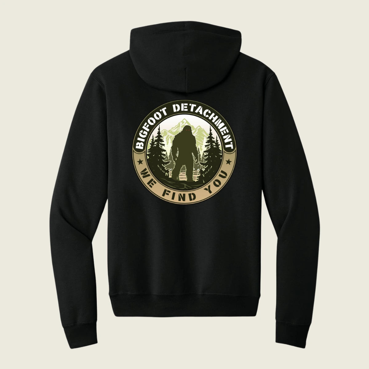 Black hoodie with Bigfoot Detachment graphic on the back against a beige background