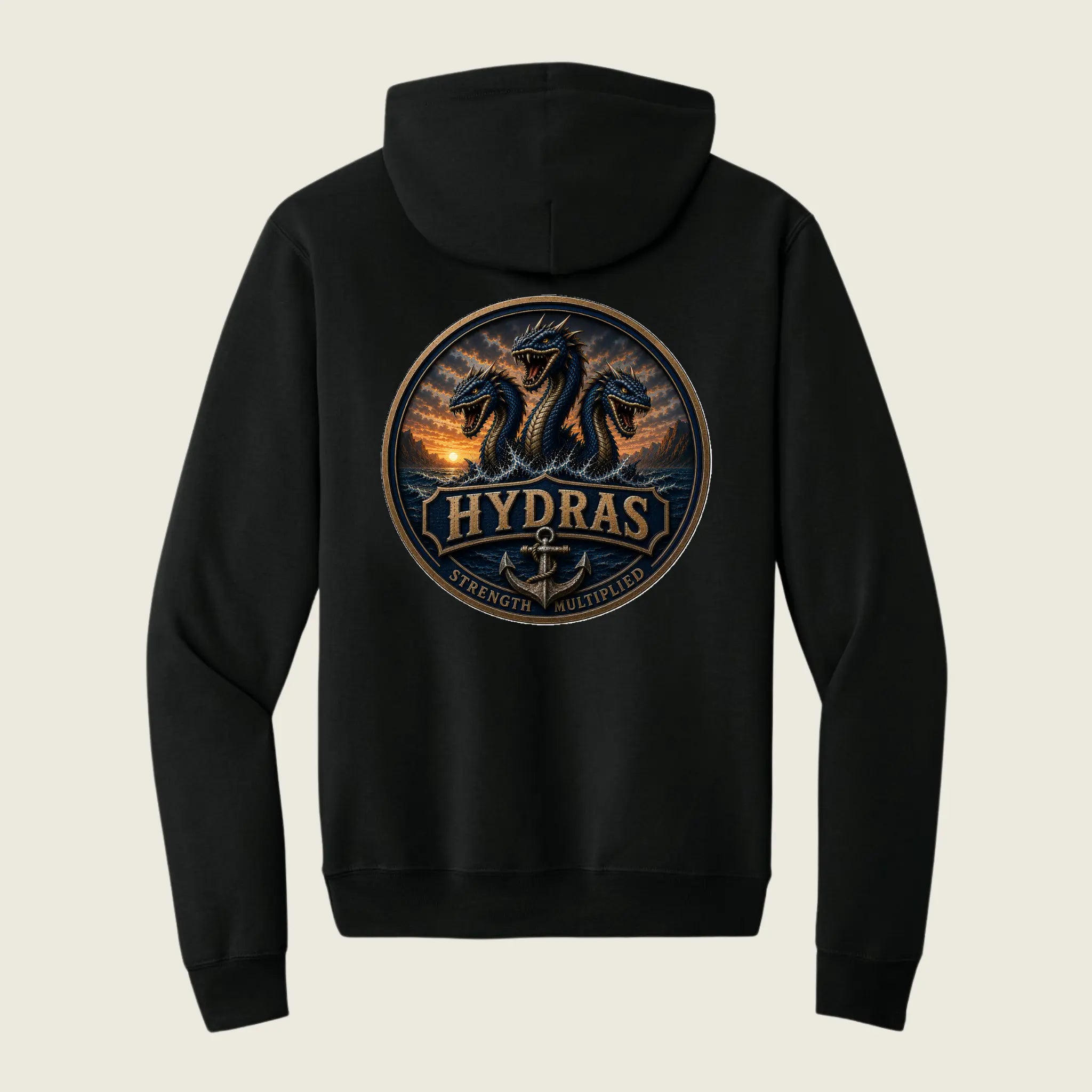 A black pullover hoodie shown from the back, featuring a large circular graphic print of three dragons with the word 'HYDRAS' and an anchor in the center, set against a light beige background