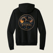 A black pullover hoodie shown from the back, featuring a large circular graphic print of three dragons with the word 'HYDRAS' and an anchor in the center, set against a light beige background