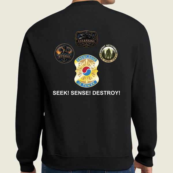 A person shown from the back wearing a black crewneck sweatshirt with military-style insignia patches and the text 'SEEK! SENSE! DESTROY!' printed on the back.