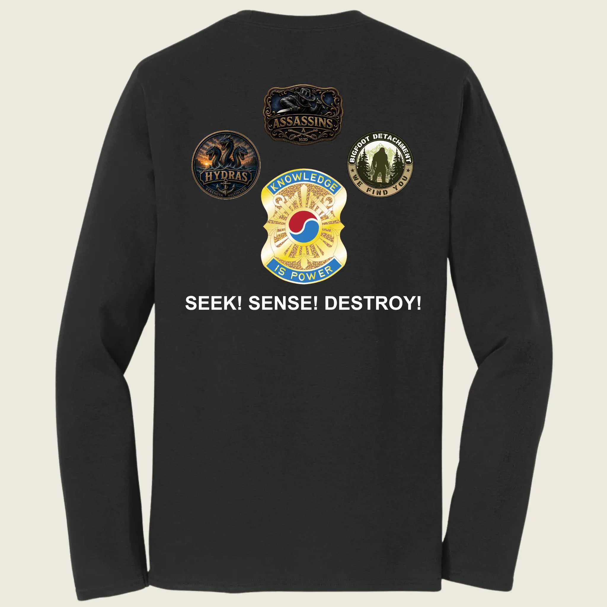 Black long-sleeve t-shirt showing the back with a graphic of four military-style insignias and the text 'SEEK! SENSE! DESTROY!' in white.