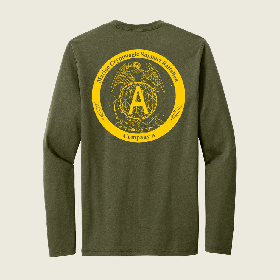 An olive green long-sleeve t-shirt shown from the back, featuring a large yellow circular graphic with the USMC Eagle, Globe, and Anchor emblem, a large letter 'A', and the text 'Marine Cryptologic Support Battalion' and 'Company A'.