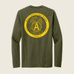 An olive green long-sleeve t-shirt shown from the back, featuring a large yellow circular graphic with the USMC Eagle, Globe, and Anchor emblem, a large letter 'A', and the text 'Marine Cryptologic Support Battalion' and 'Company A'.