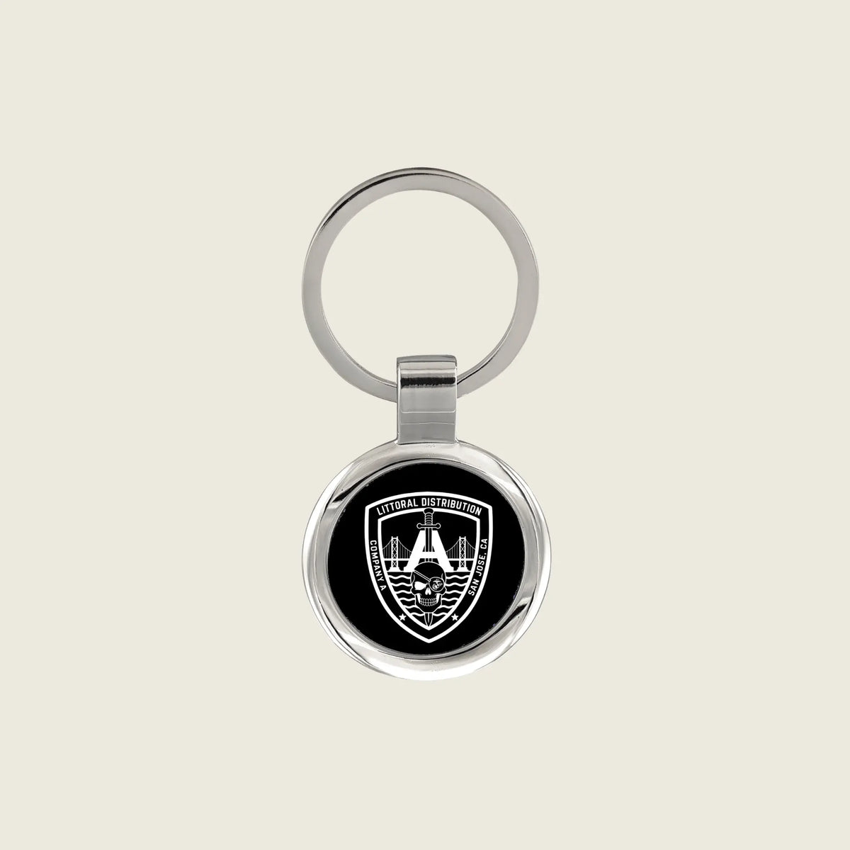 Keychain with a company logo engraved on it in white