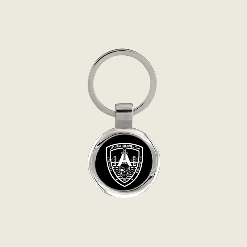 Keychain with a company logo engraved on it in white
