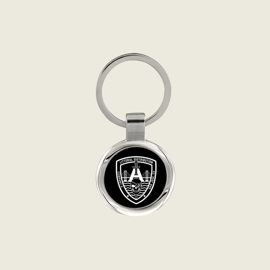 Keychain with a company logo engraved on it in white