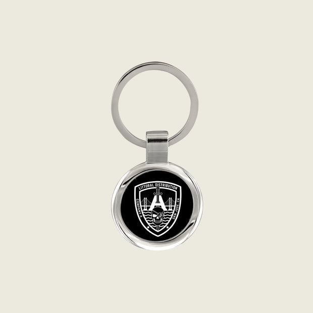 Keychain with a company logo engraved on it in white