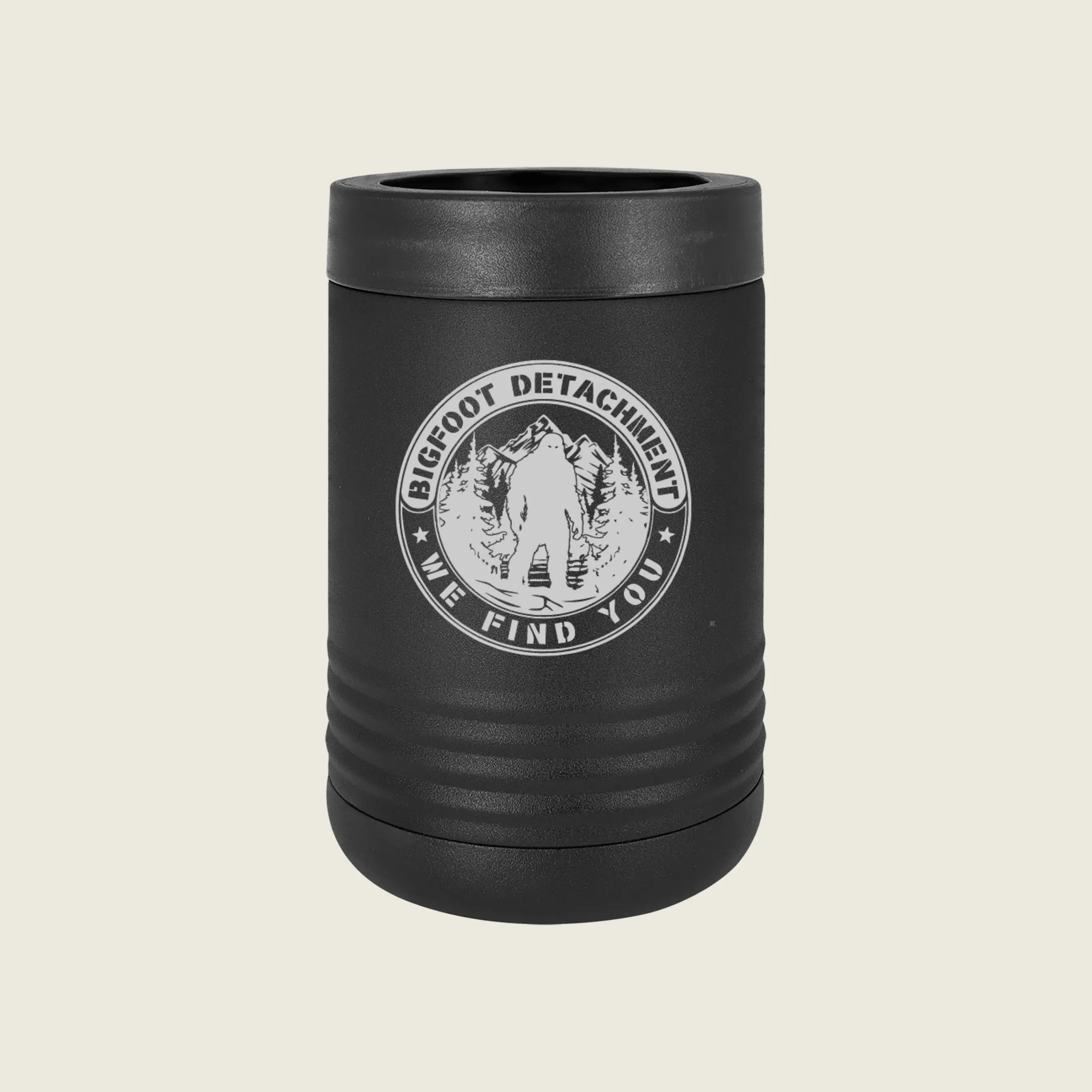 Black koozie with 'Bigfoot Detachment' logo on a beige background