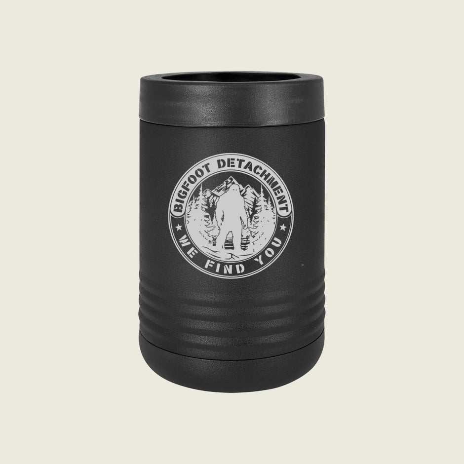 Black koozie with 'Bigfoot Detachment' logo on a beige background